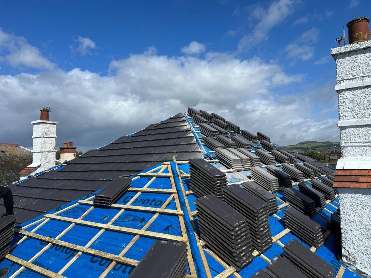 Roof being re-slated over new blue breathable membrane and battens